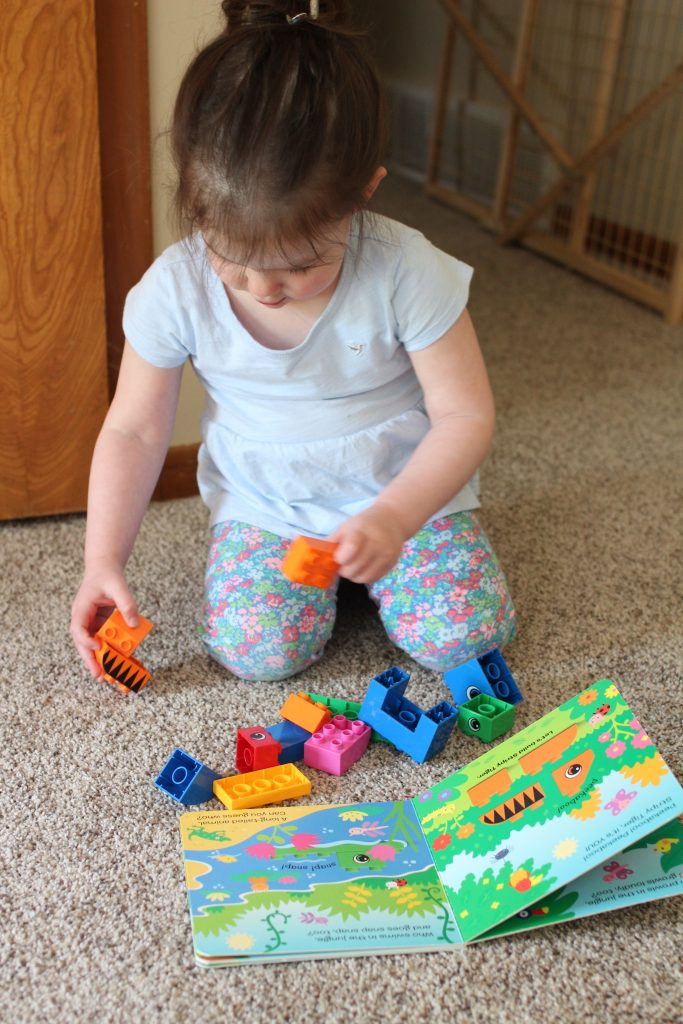 These read and build lego books are so fun for toddlers! A cheap activity to develop toddlers' spatial skills and teach them how to follow lego directions.