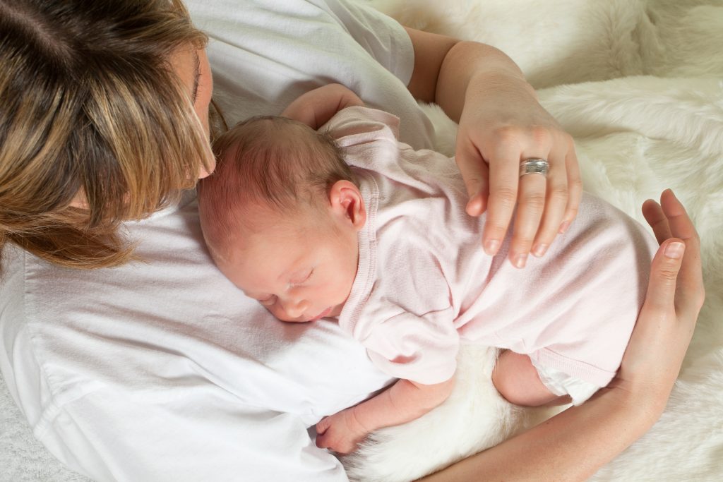 can newborn sleep on your chest safely